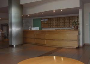 a waiting room with a counter in a building at Pastoral Lodge at the Sanctuary of the Divine Mercy in Kraków