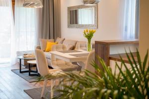 a living room with a table and a couch at Montefiori Lux View Apartment in Kotor