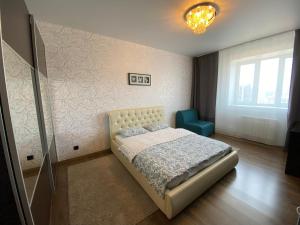 Postel nebo postele na pokoji v ubytování Apartment near Kazan Arena