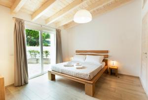 Tempat tidur dalam kamar di Villa Summer Luxury Apartment