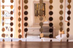 a room with a mirror and a bed and a table at Yria Hotel in Zakynthos Town