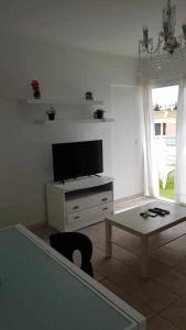 Televízia a/alebo spoločenská miestnosť v ubytovaní Apartamento Vista Lobos