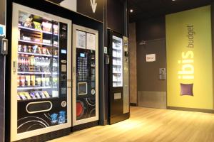 a store with a soda vending machine in a room at ibis Budget Paris La Villette 19ème in Paris