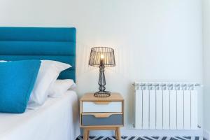 A bed or beds in a room at Rio Plaza en Madrid