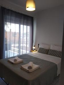 A bed or beds in a room at Precious Diamond with view - parking place and superfast WiFi