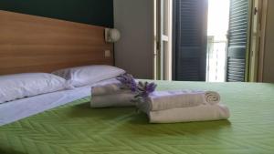 Postel nebo postele na pokoji v ubytování Il Piccolo Albergo Matera
