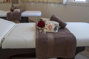 Posteľ alebo postele v izbe v ubytovaní Luxmarì Hotel & Spa