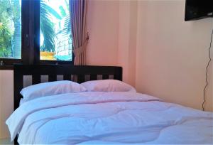 Postel nebo postele na pokoji v ubytování Anantaya Home Denpasar