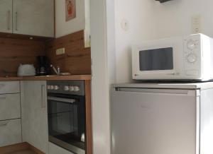 Kuchyň nebo kuchyňský kout v ubytování Ferienhaus Bayerwald