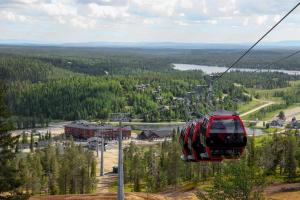a gondola ride on a ski lift in the mountains at Ski-Inn RukaValley in Ruka