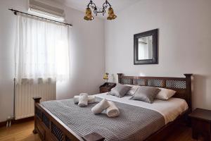 Postel nebo postele na pokoji v ubytování Cinco Suites