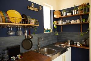 A kitchen or kitchenette at Mosaics aprtm in the Historical centre with Acropolis view