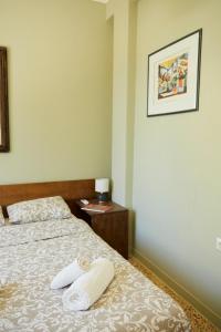 A bed or beds in a room at Mosaics aprtm in the Historical centre with Acropolis view
