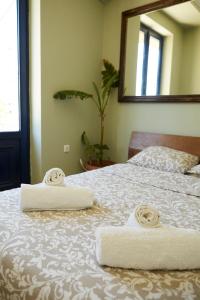 A bed or beds in a room at Mosaics aprtm in the Historical centre with Acropolis view
