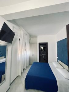 Ein Bett oder Betten in einem Zimmer der Unterkunft CARFAGNINI ROOMS