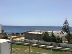 a view of the ocean from a building at Arabesque Style - 2 appartements in Kelibia