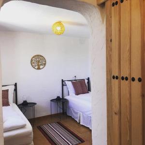 Postel nebo postele na pokoji v ubytování Casa Olivar B&B