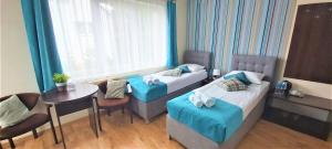 Postel nebo postele na pokoji v ubytování Villa Magna