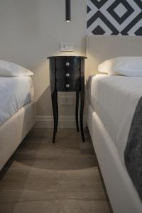 Posteľ alebo postele v izbe v ubytovaní Luxmarì Hotel & Spa
