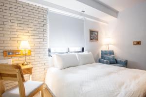 Postel nebo postele na pokoji v ubytování 4 Design Inn