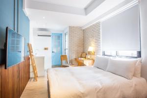 Postel nebo postele na pokoji v ubytování 4 Design Inn