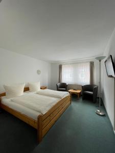 Postel nebo postele na pokoji v ubytování Hotel Garni „zum Bären“