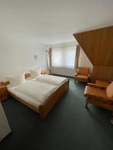Postel nebo postele na pokoji v ubytování Hotel Garni „zum Bären“