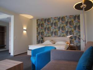 Ein Bett oder Betten in einem Zimmer der Unterkunft Akzent Hotel Haus Surendorff
