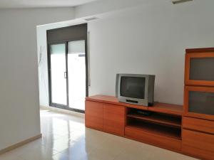 Televízia a/alebo spoločenská miestnosť v ubytovaní Vicmar Home Apartment I