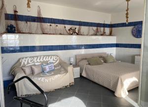Posteľ alebo postele v izbe v ubytovaní SUITE ISOLA BELLA