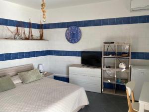 Posteľ alebo postele v izbe v ubytovaní SUITE ISOLA BELLA