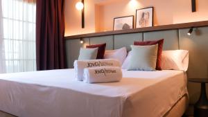 Postel nebo postele na pokoji v ubytování JovA Hotel Boutique