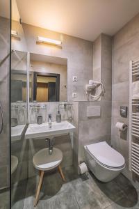 Koupelna v ubytování TIMEOUT City Hotel