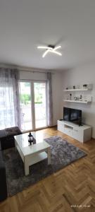a living room with a couch and a coffee table at Apartman Rosić in Trebinje