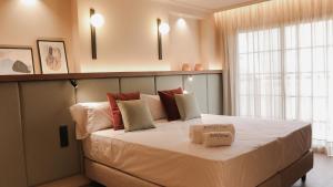 Postel nebo postele na pokoji v ubytování JovA Hotel Boutique