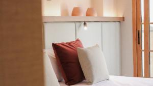 Postel nebo postele na pokoji v ubytování JovA Hotel Boutique