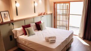 Postel nebo postele na pokoji v ubytování JovA Hotel Boutique
