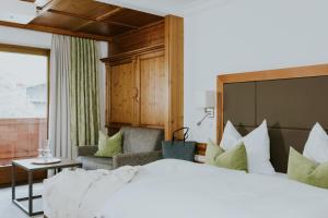 Postel nebo postele na pokoji v ubytování Hotel Tauernhof