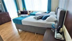 Postel nebo postele na pokoji v ubytování Villa Magna