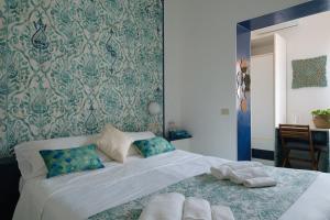 Кровать или кровати в номере Hotel Punto Verde