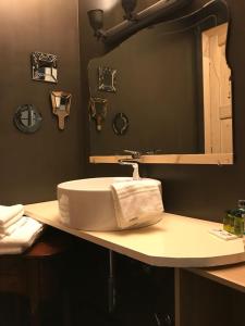 a bathroom with a sink and a mirror at Sanctus Syrus 2 in Albenga