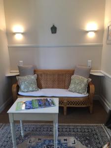 a living room with a couch and a table at Chambres d'Hôtes & Gites La Chatellenie in Saint-Aubin-le-Cauf