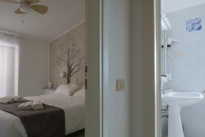 Кровать или кровати в номере Hotel Punto Verde