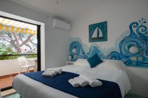 Кровать или кровати в номере Hotel Punto Verde