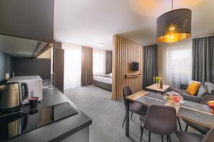 Postel nebo postele na pokoji v ubytování TIMEOUT City Hotel
