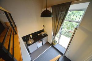 an overhead view of a kitchen with a large window at Mezzanine Hotel in Odesa