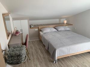 Postel nebo postele na pokoji v ubytování Apartments Nevenka i Josko