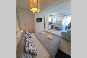 Posteľ alebo postele v izbe v ubytovaní Studio Apartment Marella