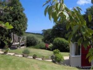 a view of a yard with a house at Frogwell in Strete