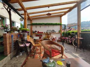a patio with chairs and a table on a patio at Green Gate Apartments in Sarajevo